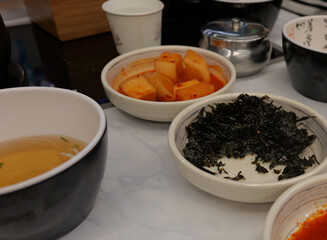 Assorted Korean Side Dishes on Restaurant Table