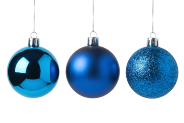 Collection of three vibrant royal blue Christmas ornaments with varied finishes: reflective glossy, smooth matte, and sparkling glitter, isolated on a white background.