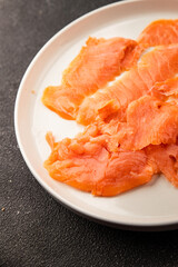 Smoked salmon fish seafood portion size natural product tasty snack fresh delicious gourmet food background on the table rustic top view copy space pescetarian diet
