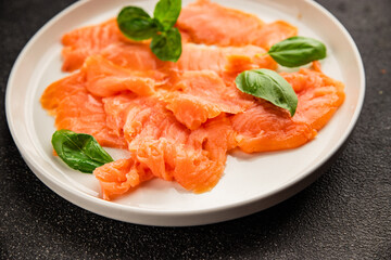 Smoked salmon fish seafood portion size natural product tasty snack fresh delicious gourmet food background on the table rustic top view copy space pescetarian diet