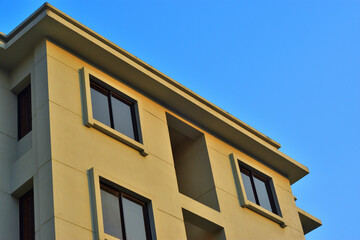 Modern Building Exterior Against Clear Blue Sky – Architectural Detail