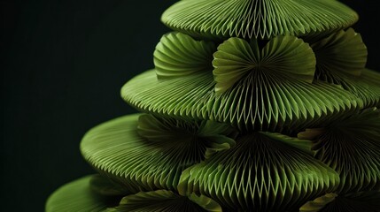 Christmas tree made from folded paper fans arranged in circular tiers,
