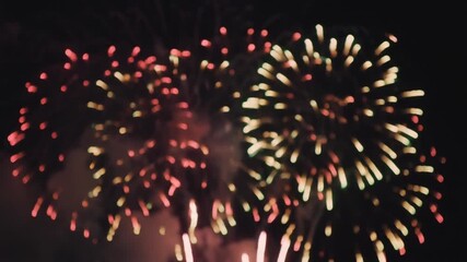 A mesmerizing display of colorful, blurry fireworks exploding in the night, capturing the magical and exciting atmosphere of a festive celebration
