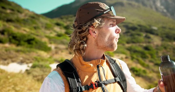 Man, drink or hiker with water on mountain for outdoor adventure, exploration or sightseeing. Hydration, male person or mineral liquid with rest, break or aqua beverage for trekking journey in nature