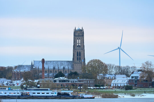 Zaltbommel Skyline: Church, Wind Turbine, and River Waal on a Winter Morning