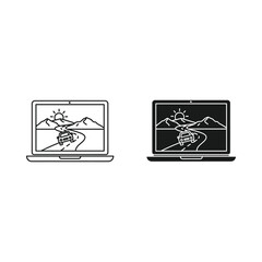 Two laptop computers displaying a mountain landscape scene