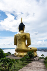 Buddha statue overlooking mekong river in laos