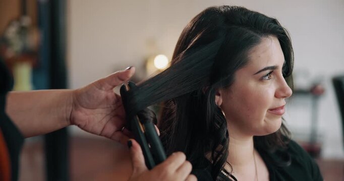 Salon, flat iron and woman with hair care for beauty, wellness and grooming service. Small business, customer and professional beautician with makeover, hairdresser and heat equipment for client - Powered by Adobe