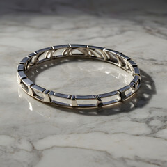A luxury silver bracelet rests delicately on a polished marble surface, displaying intricate details and captivating elegance, under soft, natural light, reflecting the fine craftsmanship.