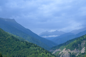 Scenic view of the rugged mountains of Svaneti, Georgia, featuring peaks, valleys, and natural landscape under natural light.