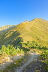 Scenic view of the rugged mountains of Svaneti, Georgia, featuring peaks, valleys, and natural landscape under natural light.