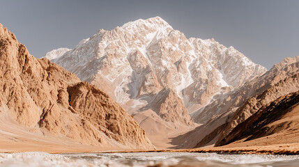 Close-up panoramic mountain landscape with rocky peaks and snow-covered ridges, a narrow valley with a snow ridge below — harsh alpine atmosphere.