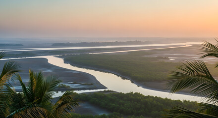 Serene River Winding Through Lush Green Mangrove Forest at Sunset with Palm Trees in Foreground