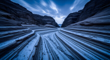 Dramatic Canyon Landscape with Flowing Rock Formations and Moody Sky During Blue Hour Photography