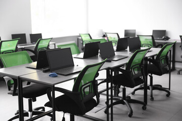 Computer science class with laptops at school