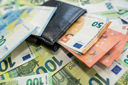 Euro banknotes with wallet background of modern finance