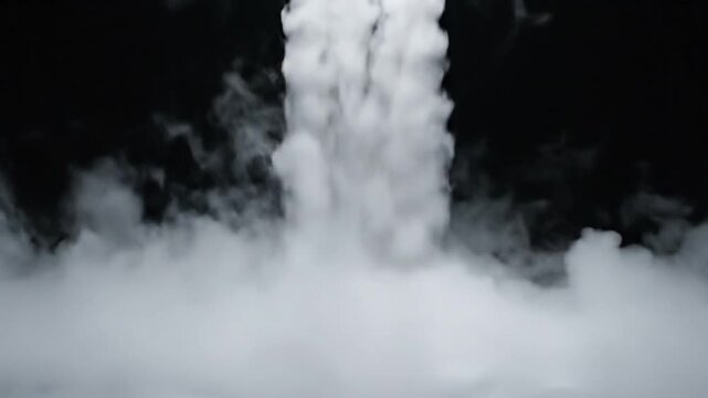 Thick white smoke or fog rising dramatically from the bottom against a solid black background