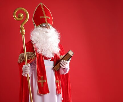 Saint Nicholas with book and crozier on red background