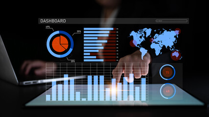 A business professional engages with a digital dashboard, showcasing various graphs, charts, and a world map, highlighting key financial insights and analytical data. Impute