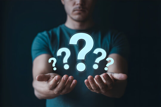 Man Holding Glowing Question Marks: Search, Uncertainty, FAQ, or Problem Solving Concept
