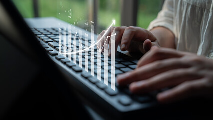 A person engaged in data analysis on a keyboard, with an overlay of a growth trend chart, symbolizing productivity and success in a modern office environment. Impute