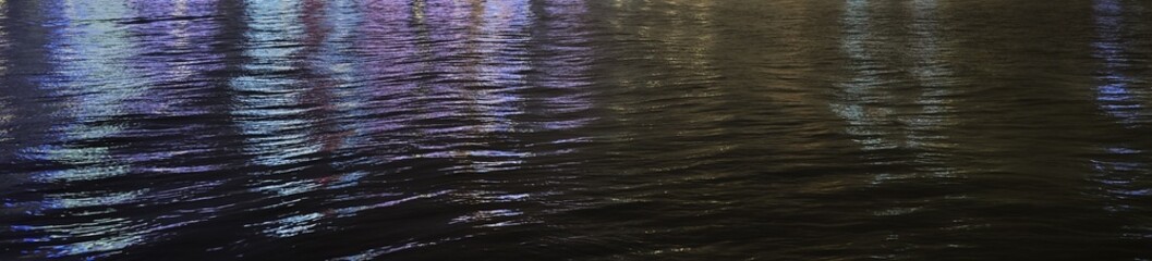 city purple blue neon light reflection on black water surface cyberpunk dark abstract background banner