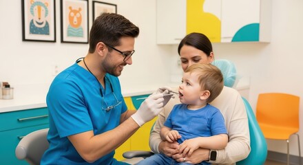 Caucasian male dentist treating young caucasian child in colorful dental office with female caucasian parent present