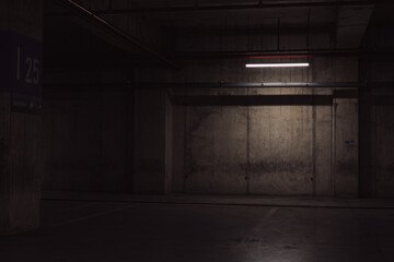 Empty parking lot with overhead dim light