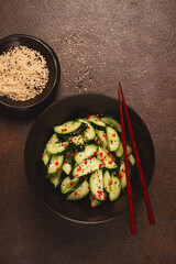 Chinese salad, cucumbers with chili pepper and sesame seeds, homemade, no people,
