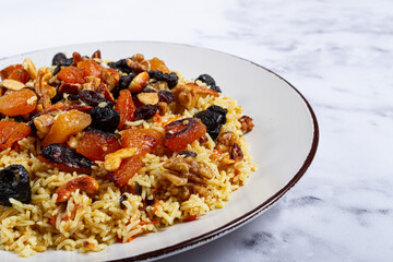 rice dish with dried fruits, nuts and spices of Middle Eastern cuisine, homemade, no people,