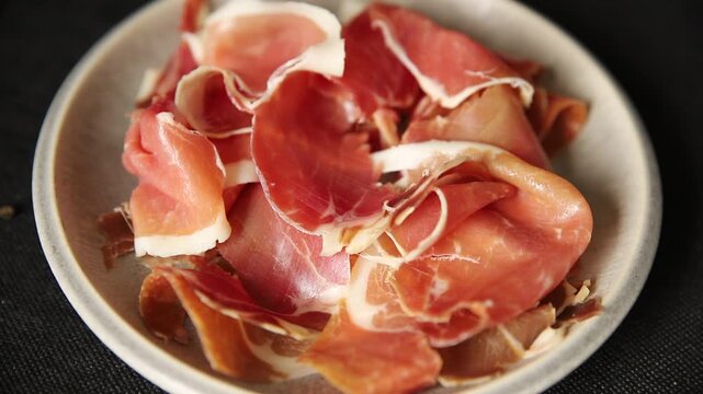 Meat jamon iberico or serrano snack fresh tasty food dish gourmet food background on the table rustic food top view copy space