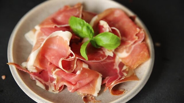 Meat jamon iberico or serrano snack fresh tasty food dish gourmet food background on the table rustic food top view copy space