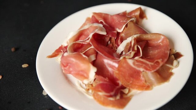 Meat jamon iberico or serrano snack fresh tasty food dish gourmet food background on the table rustic food top view copy space