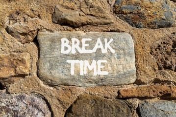 Break time symbol. Concept word Break time on beautiful grey stone on stone wall. Beautiful stone wall background. Business break time concept. Copy space.