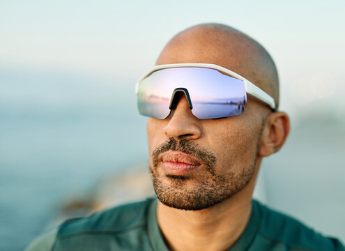 Portrait of a young man runner prepering for fitness exercise wearing vr glasses outdoors