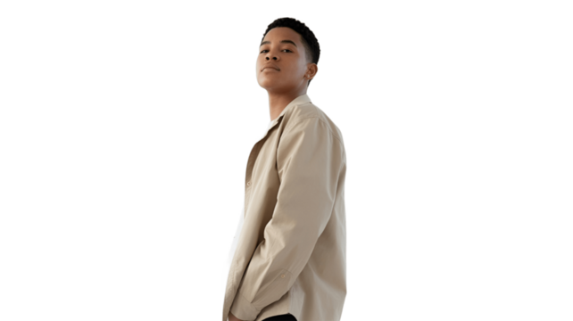 A confident young man posing stylishly, radiating an air of self-assurance and charisma.