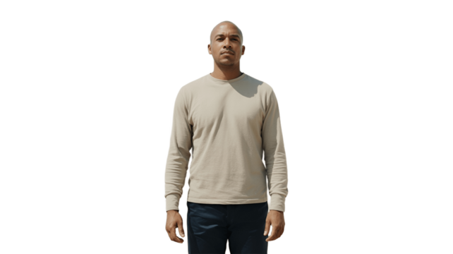 An adult male model stands confidently in front of a neutral backdrop, wearing a casual shirt and jeans.