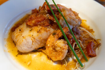 Pacific black hake served with its garnish at a restaurant in Puerto Natales, Chile.