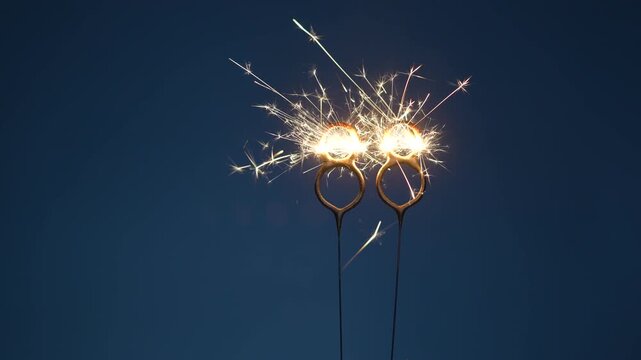88 number made with sparklers in the form of eighty eight on a dark background.
