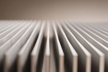 Close-up view of heat sink fin array with repeating lines and shallow depth effect
