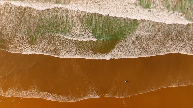 Aerial View of Surfers at Costa da Caparica Beach