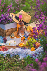 Wine in a lavender field. Selective focus.