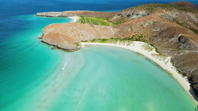 Aerial drone view of the iconic Balandra Bay with its turquoise lagoon, white sand beaches, and rocky desert surroundings in Baja California Sur, Mexico