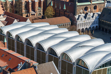 An ancient square photographed from above in the city of Love, Germany The silver roof of a modern building is visible on the left