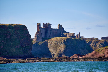 Ancient ruins overlook the blue sea along East Lothian's rugged coast.