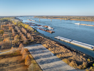 Obraz premium barges on the Ohio River at confluence with the Mississippi below Cairo, IL, November aerial view