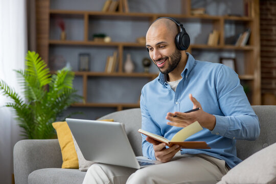 Young man having video conference call working from home