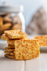 Crunchy salted crackers on whiten table.