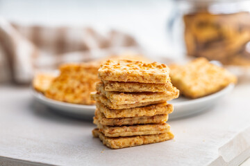 Crunchy salted crackers on whiten table.