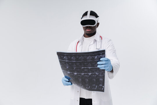 African male doctor analyzing x-rays with vr headset in medical data analysis innovation with AI Assistant